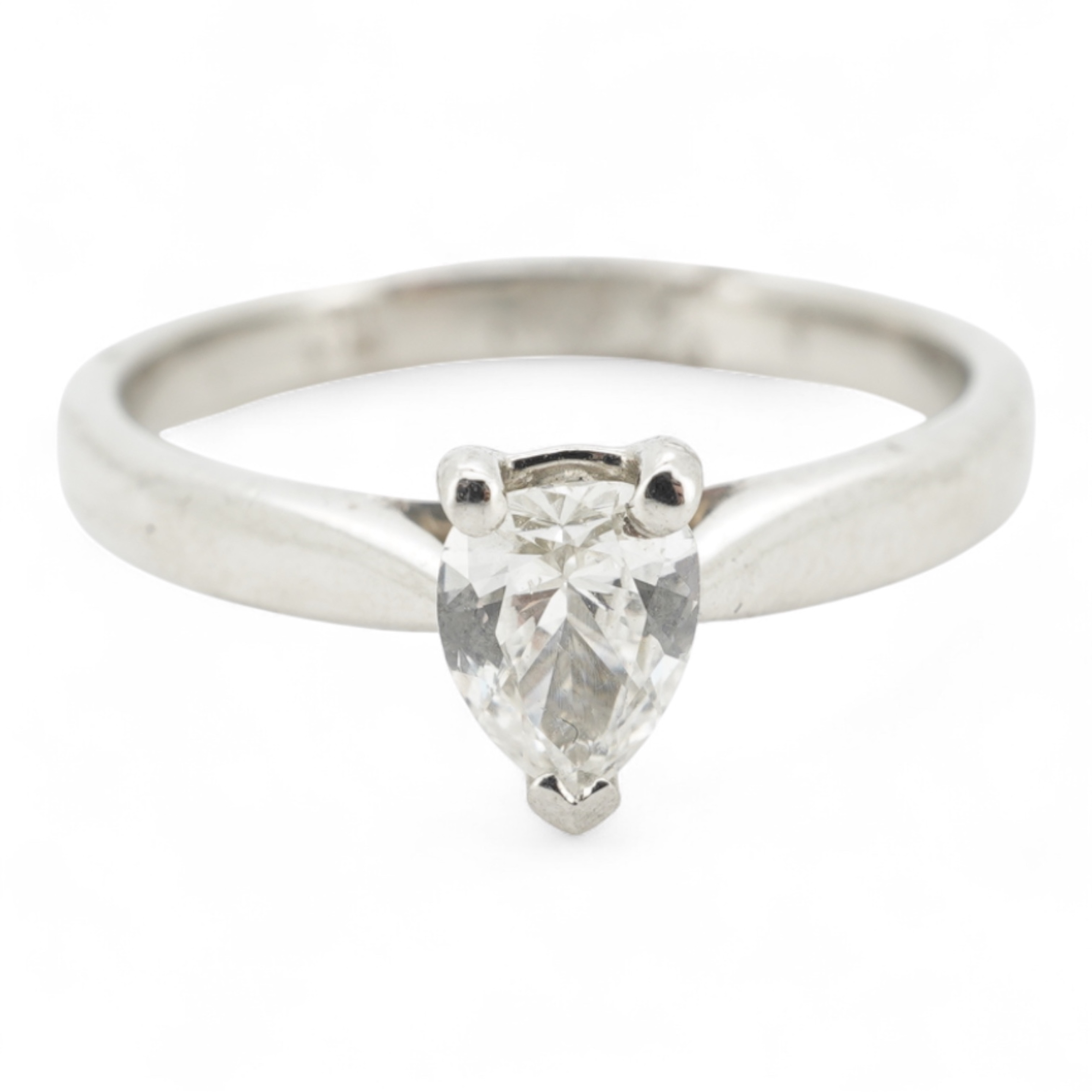 A diamond ring, claw-set with a pear-shaped diamond weighing approximately 0.45 carats, mounted in platinum, size L1/2, British hallmarks, gross weight approximately 4 grams